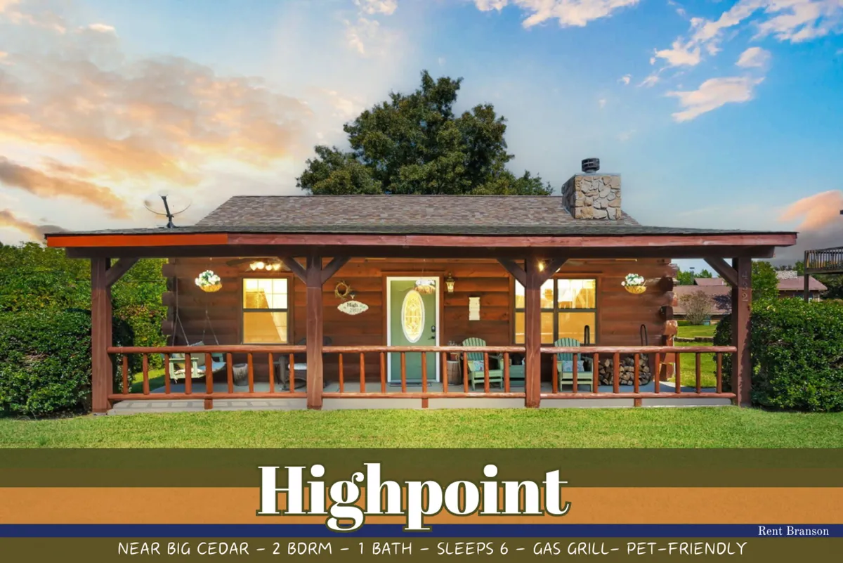 A cozy wooden porch with a stone chimney, green lawn, and welcoming front door. Family-friendly touches suggest a space perfect for grilling outdoors, playing games in the yard, or simply relaxing amidst nature.